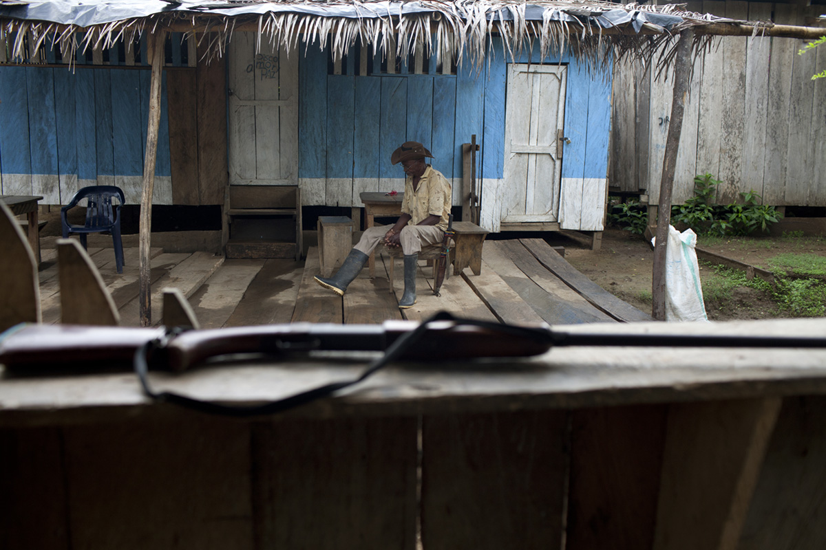 A hunter and his shotgun in the hamlet of Bijao, Colombia, 2016.